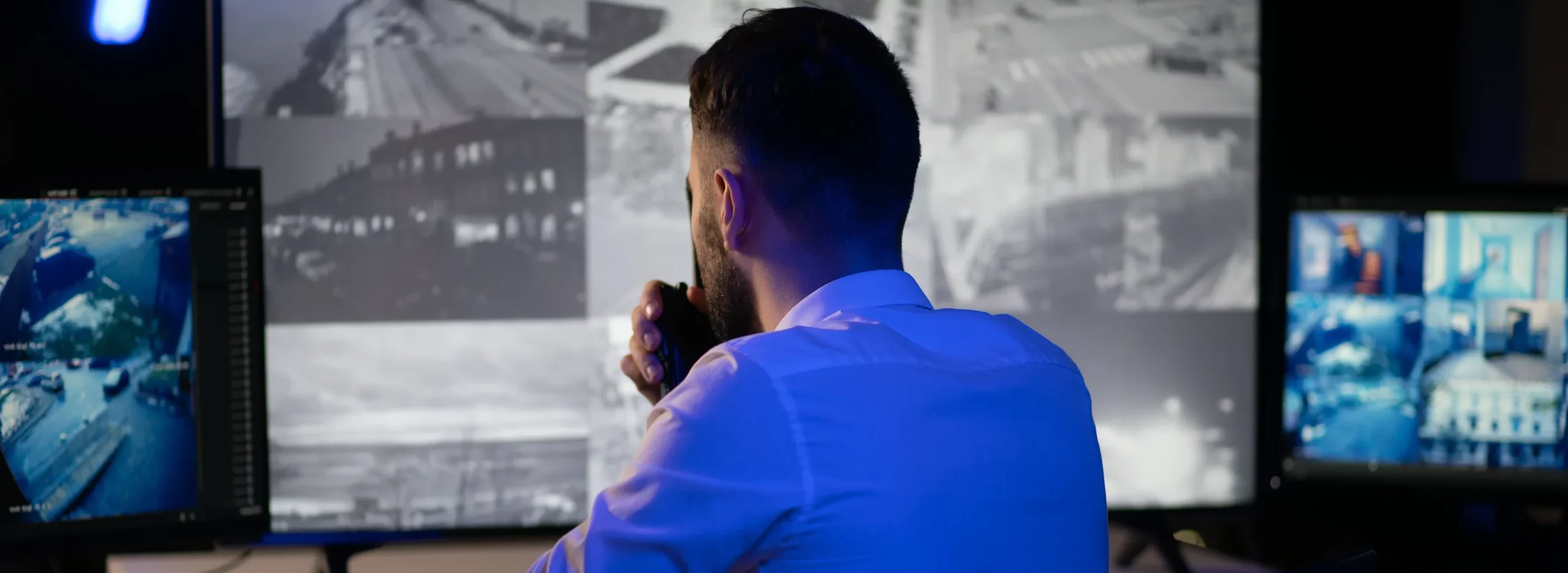 security-system-cctv-monitor-room-man-using-walki-2025-05-19-02-12-47-utc-scaled